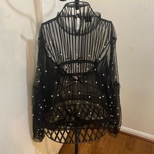 Beautiful black sheer blouse with white beads.